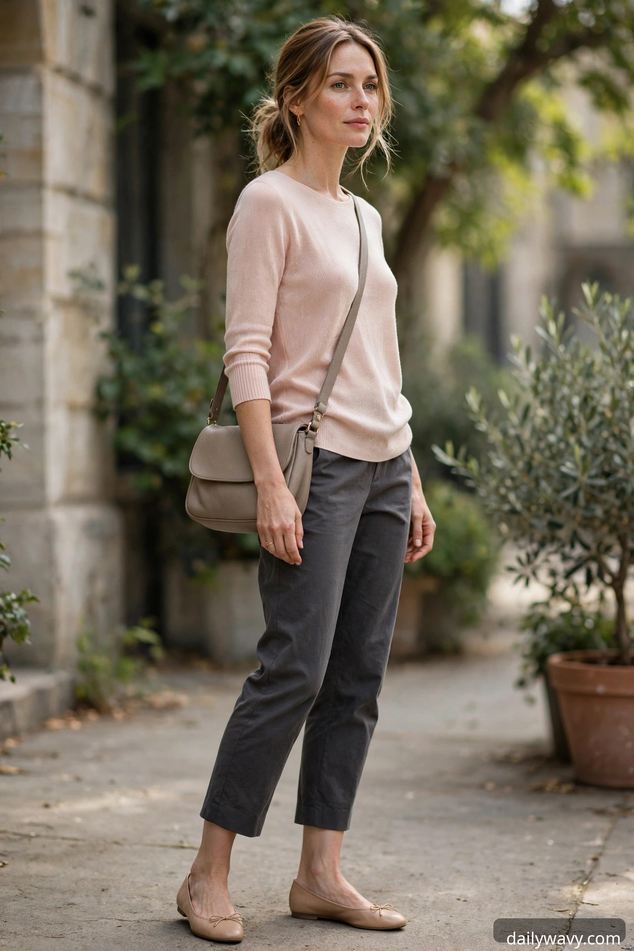 Blush fine-knit top with charcoal cropped trousers and ballet flats