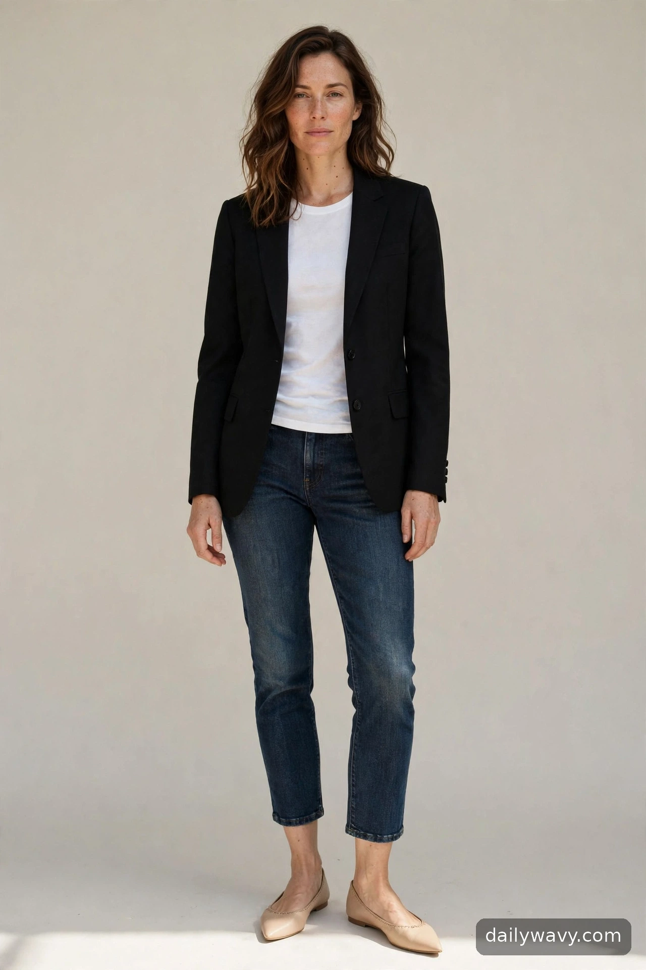 Adult wearing cropped jeans with a blazer for ballet flat outfits