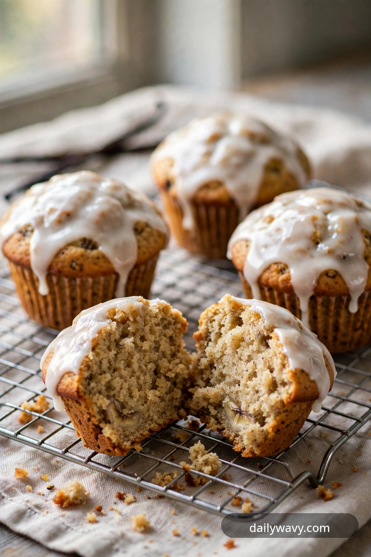Banana muffin with vanilla glaze, glossy bakery-case shine