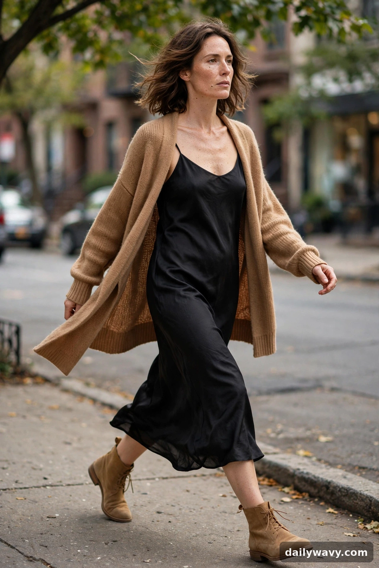 Adult wearing simple dress with a cardigan for neutral capsule wardrobe outfits