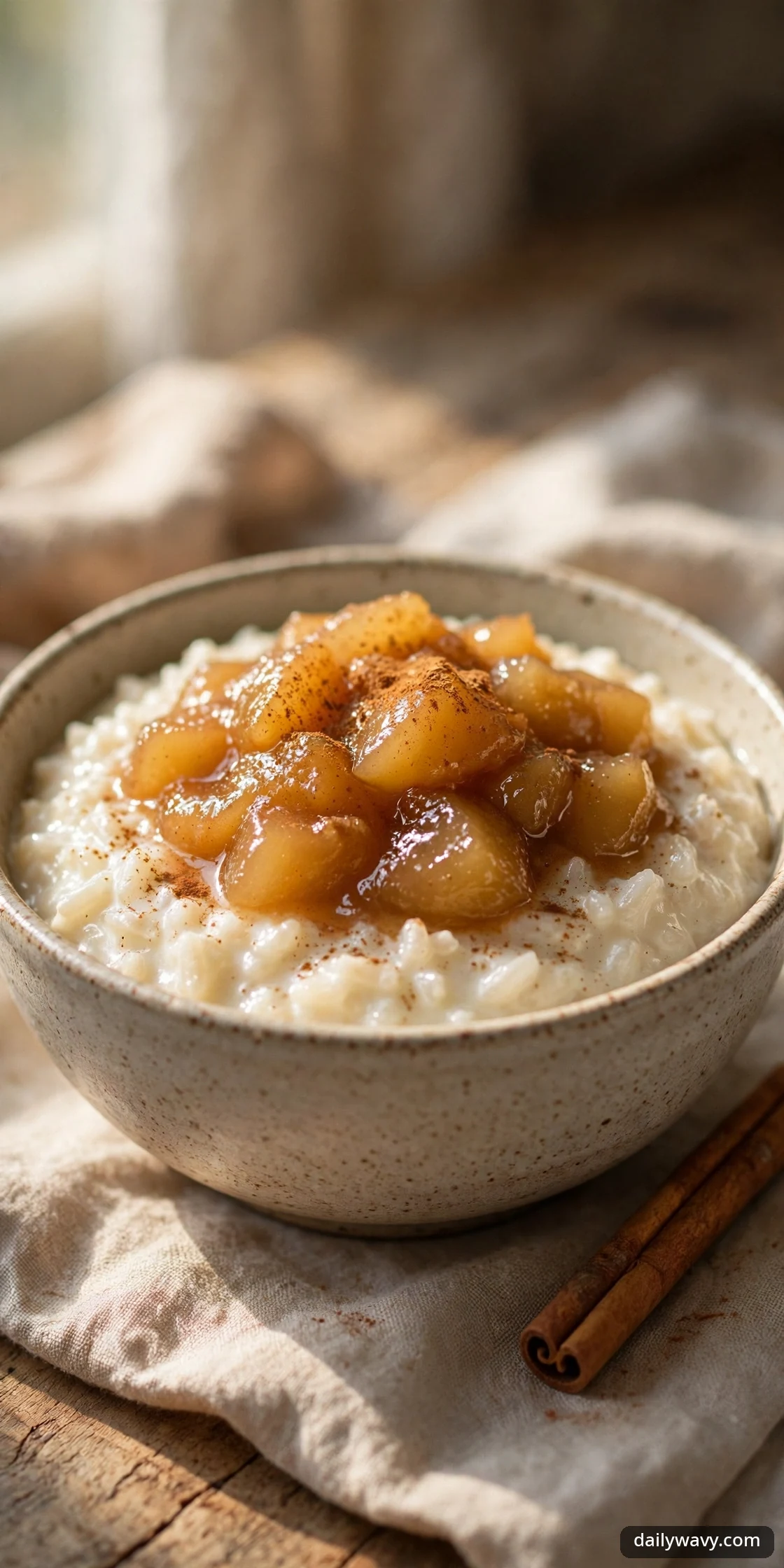 Rice pudding topped with warm pear compote and cinnamon