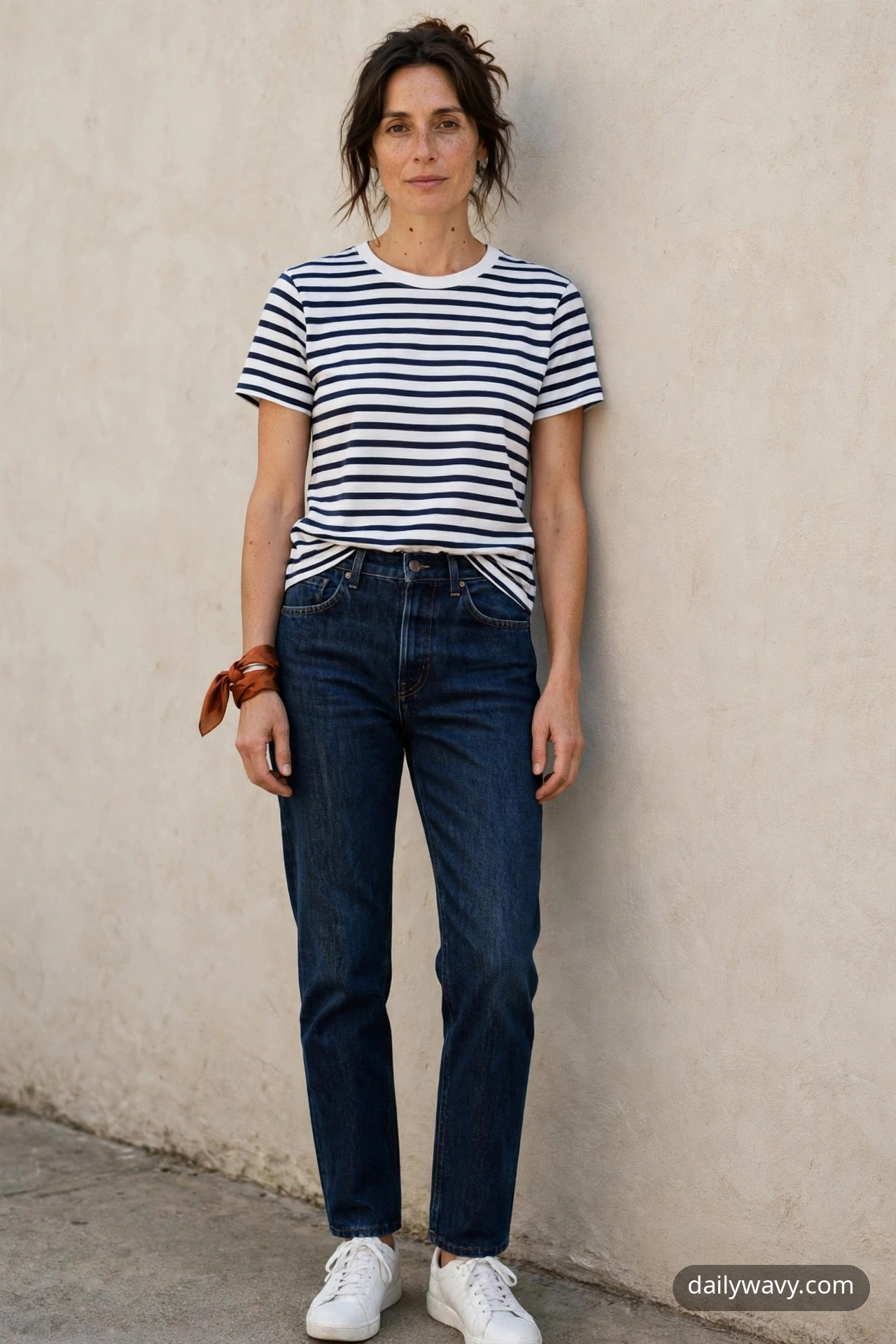 Adult wearing striped tee, dark jeans and sneakers for silk scarf outfits