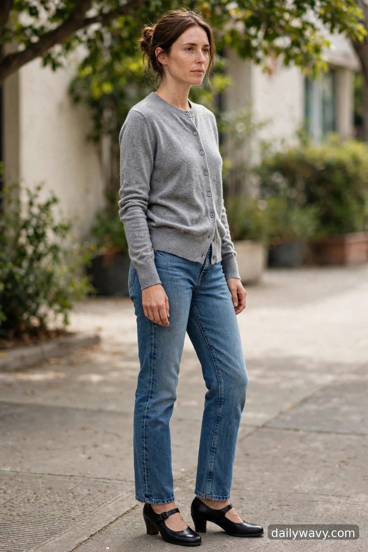 Adult wearing cardigan worn buttoned with mary janes for straight‑leg jeans outfits