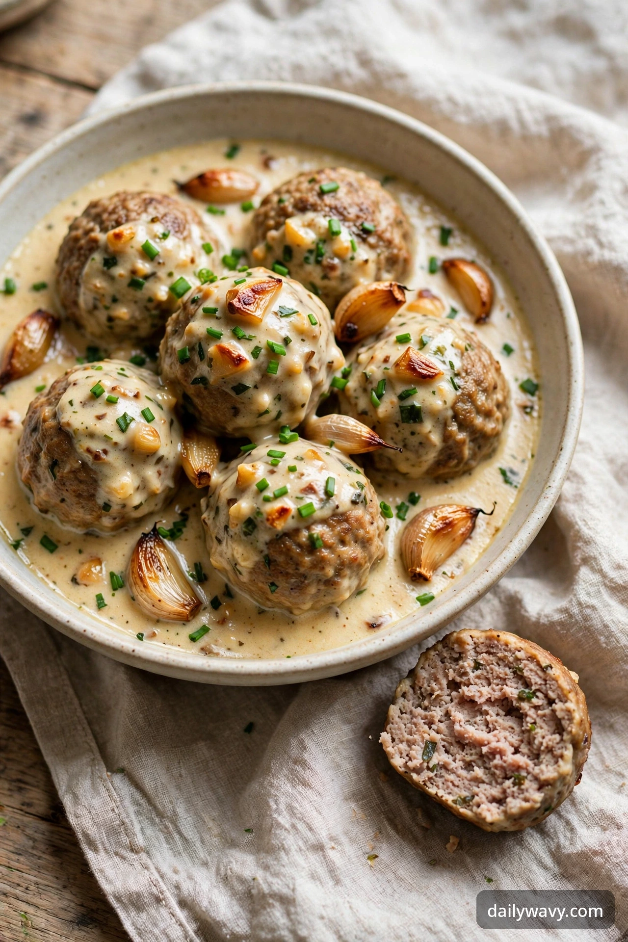 Turkey meatballs with roasted garlic sauce in a shallow bowl