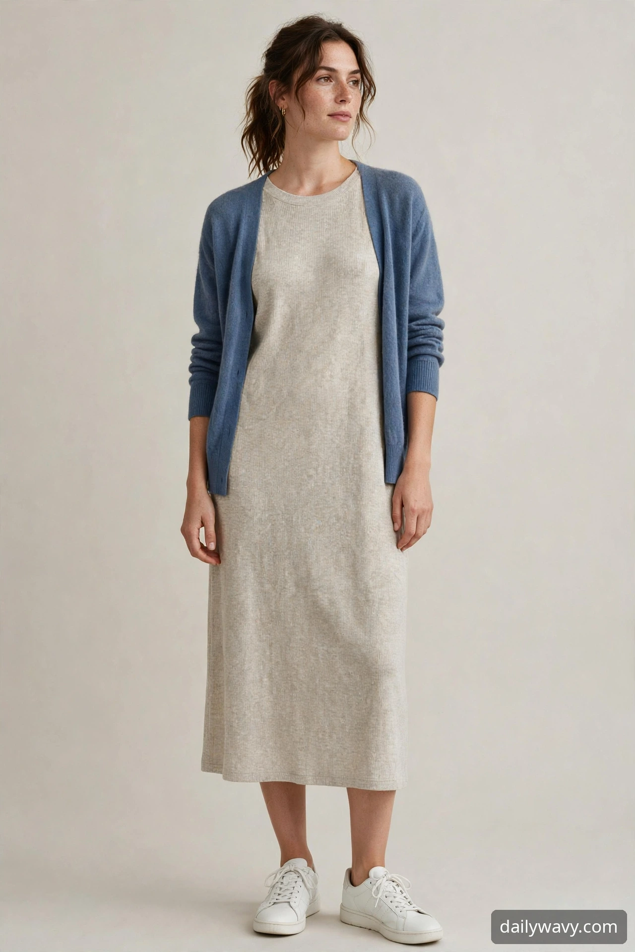 Woman wearing cardigan with a simple jersey dress as a weekend brunch outfit